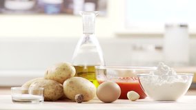 Ingredients for gnocci with tomato sauce: potatoes, egg, flour, tomato sauce, olive oil