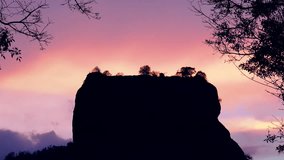 Amazing sunset zooming video of Lion Rock with ancient fortress and temple famous world heritage in Sigiriya, Sri Lanka