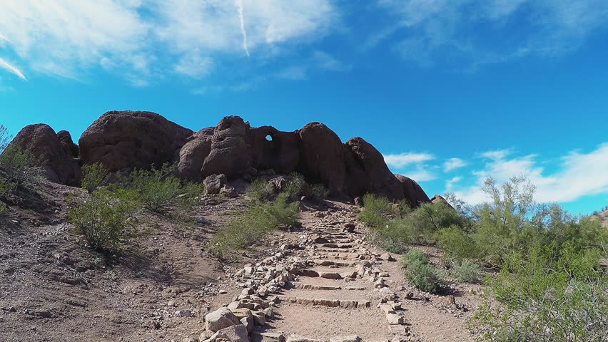 PHOENIX, AZ/USA: January 30, 2017- Low angle view of stair steps on trail to Hole In The Rock formation. Park authorities have built an easy climb natural stairway at popular attraction.
