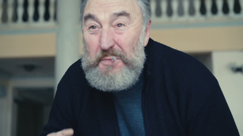 Shocked old man staring and crossing himself in 4K
