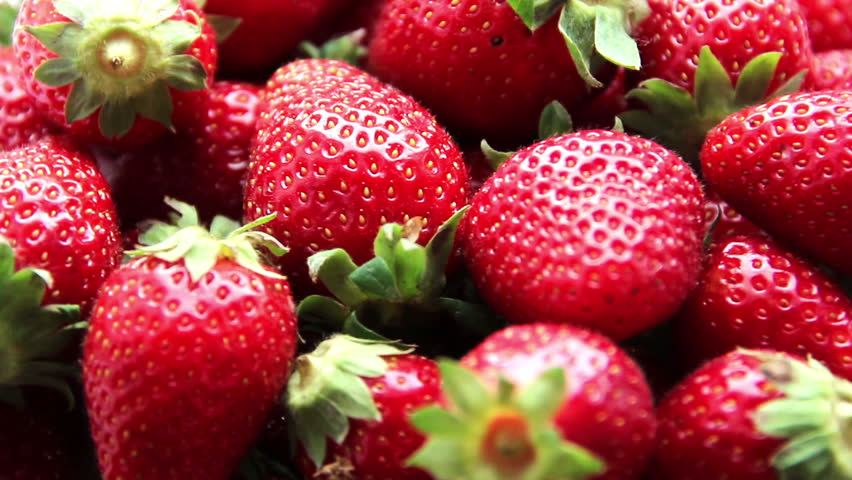 Fresh, ripe, juicy strawberries rotate. Red strawberries clockwise rotation