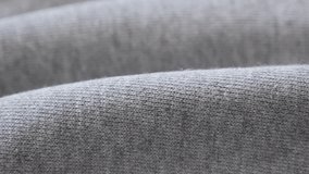 Close-up of  cotton training piece of cloth 2160p 30fps UltraHD panning footage - Gathers of fine sweating shirt or pants fabric texture slow pan 4K 3840X2160 UHD video