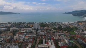 Aerial video : Flying over the Patong area in the direction of the beach and ocean in Thailand, Phuket Island.