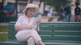 The Girl in the park with the tablet