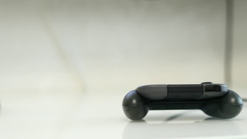 Gamepads On A White Table