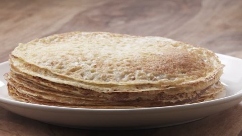 Slow motion of blin or crepe falling on stack, 180fps prores footage