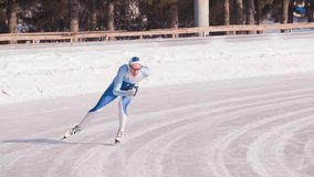 Speed ice skater skating on outdoor race on turn HD slow-motion video. Professional athlete training for winter olympic.