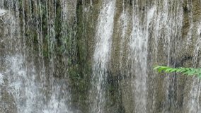 Waterfall on rock closeup outdoor nature blur background