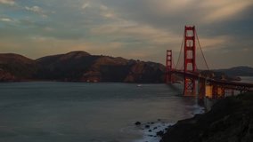 Time lapse video of a sunrise at the Golden Gate Bridge with boat and vehicle traffic. 4k time lapse, 4096x2304.