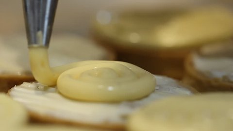 Chocolatier make Patisserie dessert mini tart lemon with caramel, chocolate and lemon pie