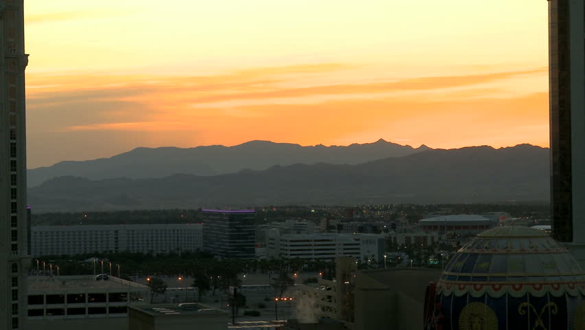An airplane is approching Las Vegas Airport for Touchdown during sunrise