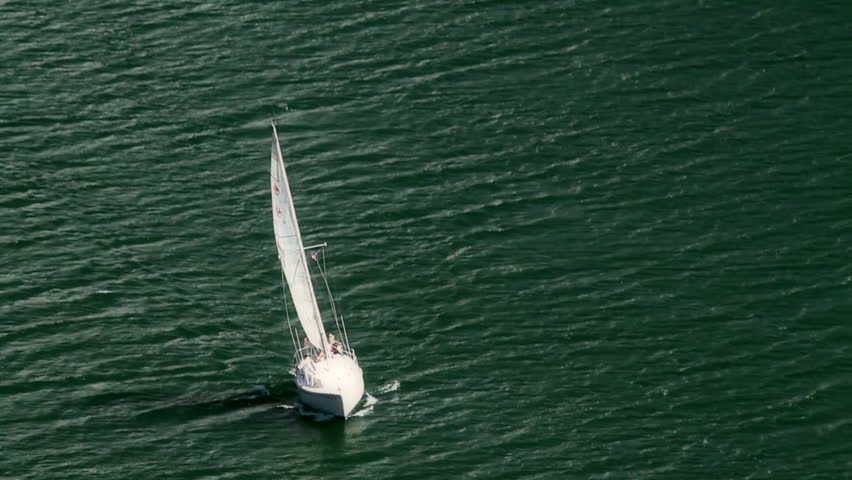 Sailboat sailing in the strong winds. Aerial view, HD 1080p.
