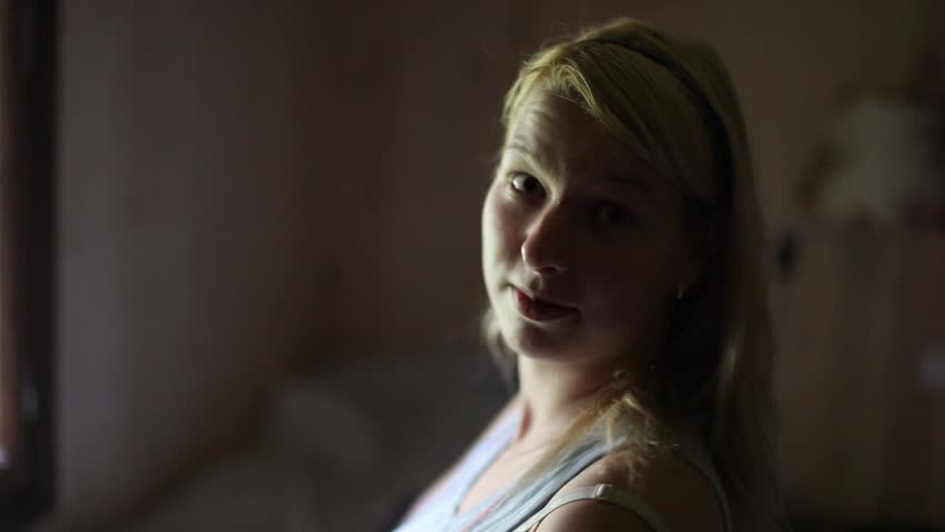 Young blonde woman smiling indoors | Shutterstock HD Video #24578015