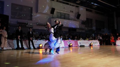 Poltava, Ukraine, Dec 2016 : A lot of couples dancing passionate Latin dance in the ballroom.