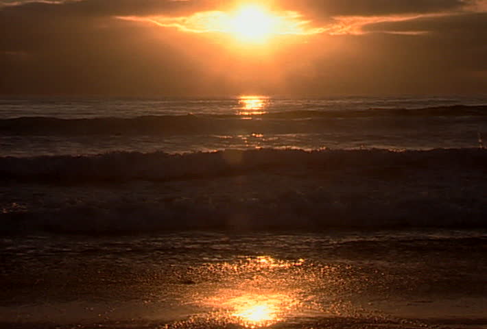 Unidentified children running into the San Diego surf at sunset in 2002.