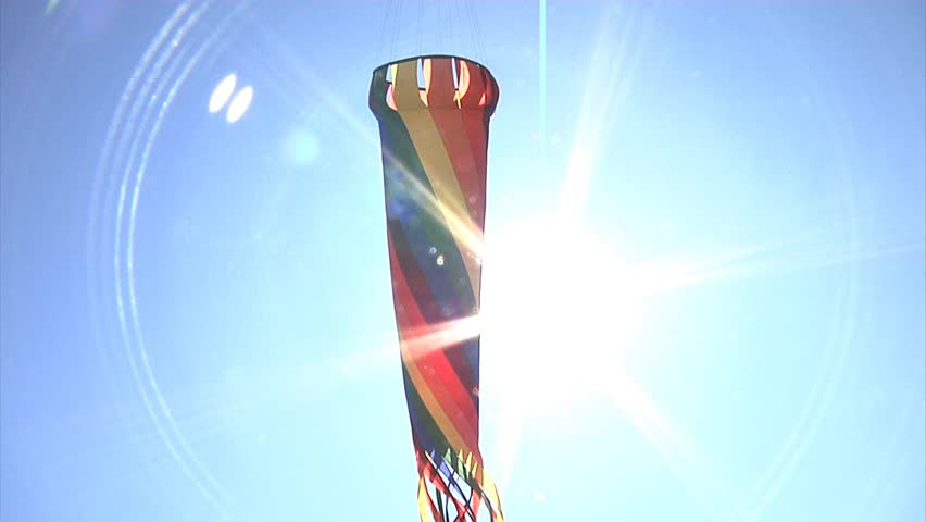 Large rainbow kite flying in the sky.