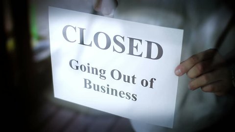 A CLOSED going out of business sign.