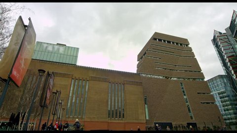 TATE MODERN, LONDON - FEBRUARY 26, 2017: The Tate Modern seen from Holland Street pan to Bankside Lofts. 4K