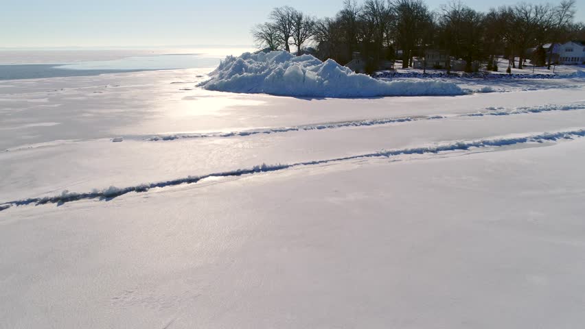 Lake Winnebago, WI, Ice shoves build small mountains of ice along the shoreline; sometimes destructive, they are driven by winds that grip the surface ice and jamb it into the opposite shore.