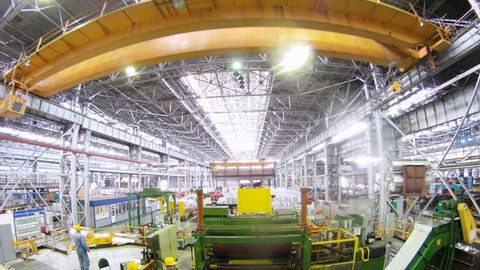  (Timelapse View) Yellow crane moves from above in production shop of Plant of aluminum alloys