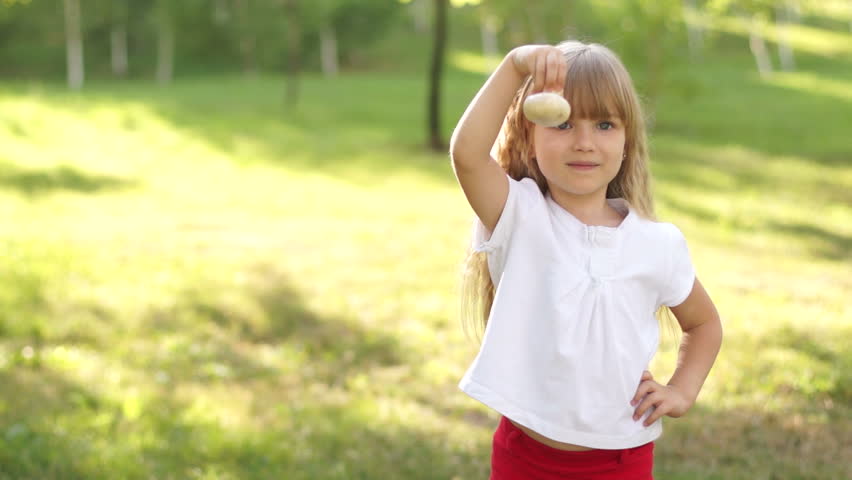 Child holding a mushroom

