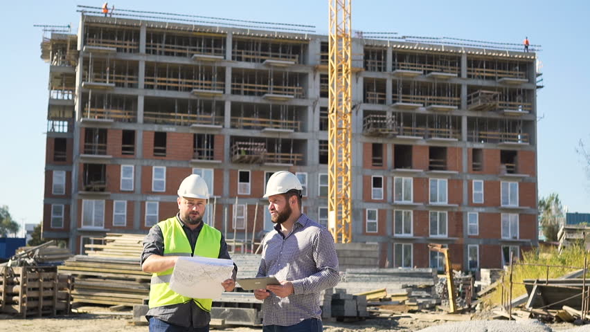 Construction manager explains investor work progress. Royalty-Free Stock Footage #24625616
