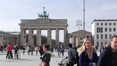 BERLIN, GERMANY - MAR 04, 2017: People Tourists Crowd Walk On Square Near Brandenburg Gate