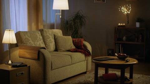 Long Shot of a Living Room in the Evening. Lights are on, Colors are Soft and Cozy. Shot on RED EPIC-W 8K Helium Cinema Camera.