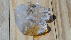 Melting Ice time-lapse on wooden floor, background in Summer sun shine 