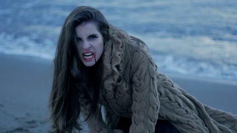 Female vampire screaming after having killed lover desperate