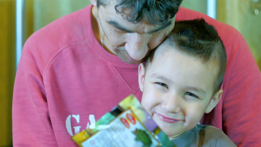 Father and son looking into the camera