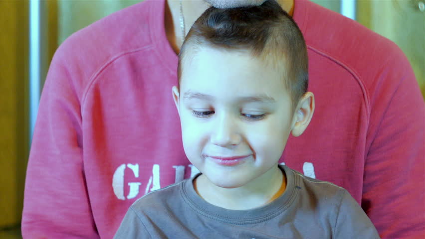 Father and son looking into the camera