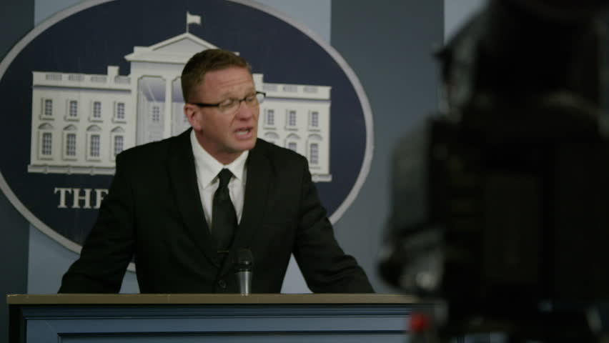 Press Secretary - Rack focus from podium to camera - white house
