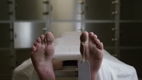 Morgue - tilt down to reveal male feet