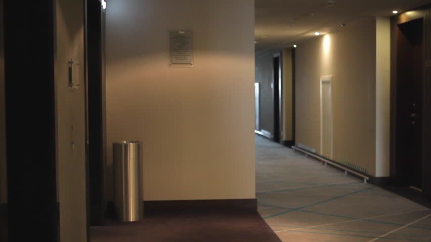 Businesswoman walks through the hotel corridor