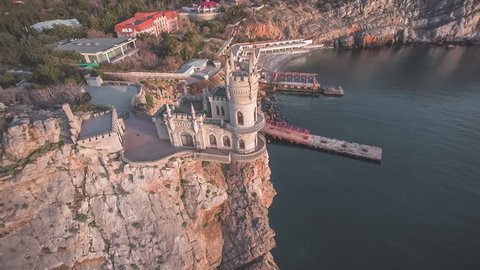 Aerial shot of the Swallow's nest, scenic castle and iconic landmark over the Black Sea in Yalta, Crimea