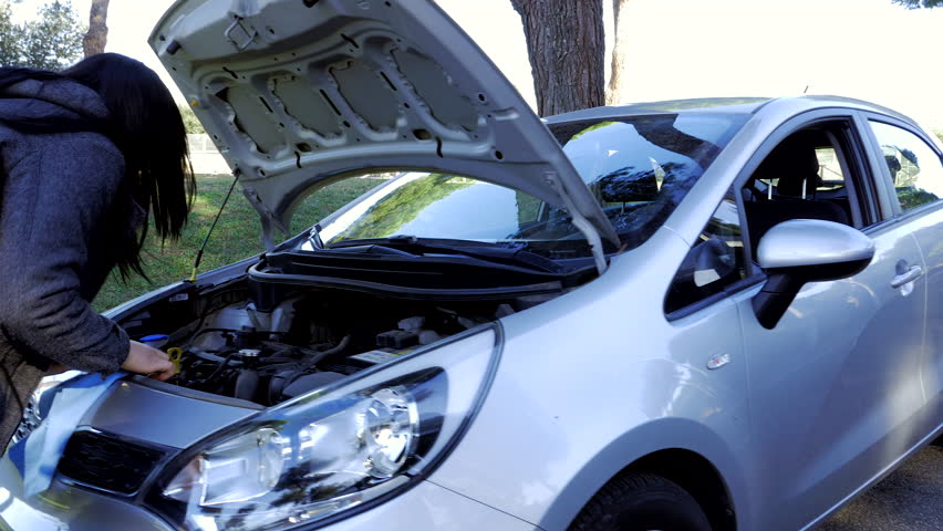 woman asking for help for broken car on roadside