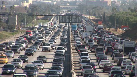 Los Angeles, CA - CIRCA February 2006: Heavy traffic on a freeway is the reason why Californians spend more time in traffic than any other state.