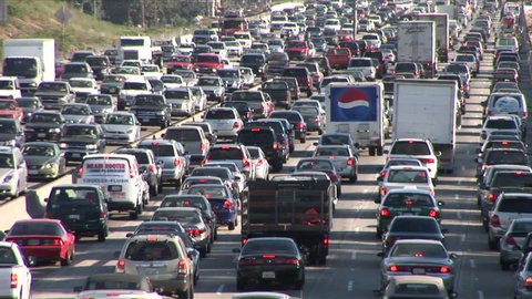 Los Angeles, CA - CIRCA February 2006: Heavy traffic on Freeway results in 93 hours of delays per person every year.