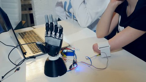 Young Woman Testing Robotic Bionic Arm Stock Footage Video (100% ...
