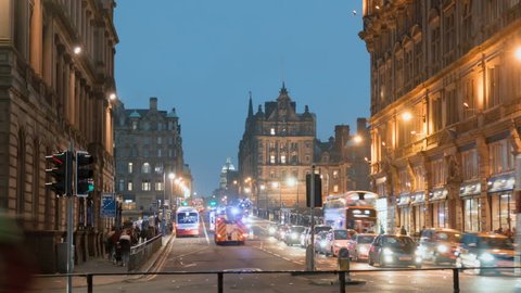 EDINBURGH, SCOTLAND - JAN 24: (Timelapse)  City nightlife on Princes Street downtown Edinburgh, Scotland on January 24, 2017. Princes St is the busiest road in Edinburgh and its main shopping center.