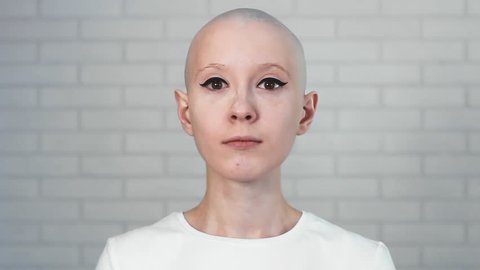 Portrait of a happy cancer survivor woman smiling and looking into the camera