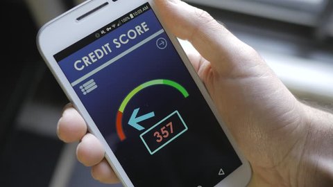 Credit score app on smartphone showing a bad credit history result to the user.