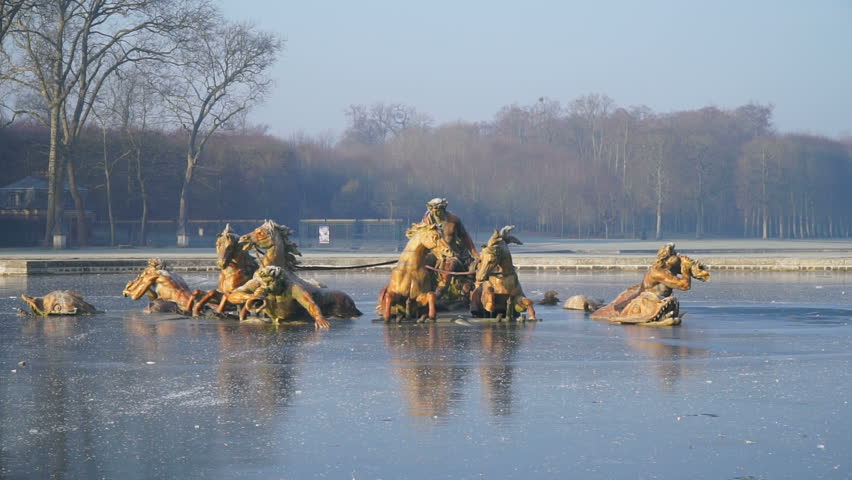 Beautiful statues in a frozen fountain in Versailles Park, Go Everywhere
