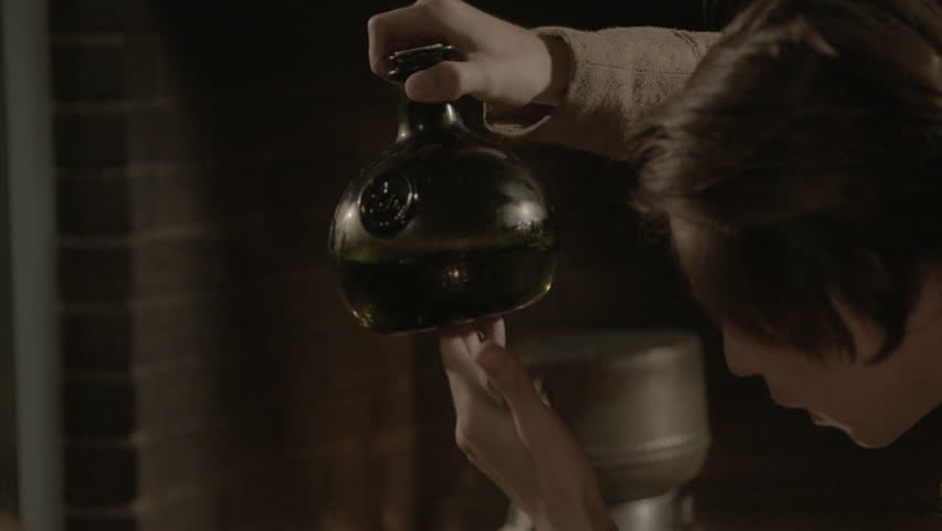 VIRGINIA - SUMMER 2016 - Reenactment, Recreation, old Tavern, saloon, bar before fireplace - 18th / 19th man works century alcohol distillery, still - copper pipes, mash and rum bottles. Gin, whiskey 