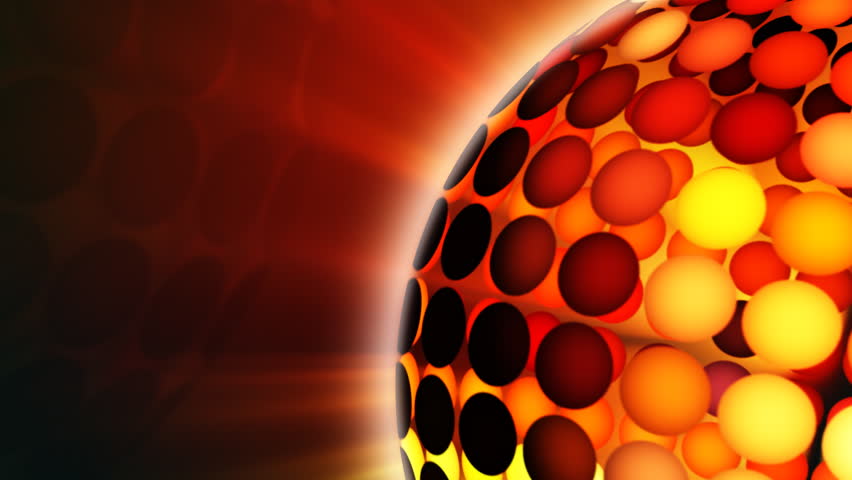 Rotating disco sphere close-up in yellow, orange, red and white colors.