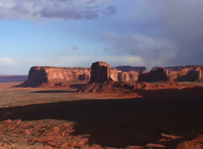 Time lapse clouds cross Monument Valley National Monument in Utah.