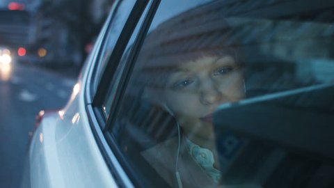 Businesswoman in the Car Looking Through a Window