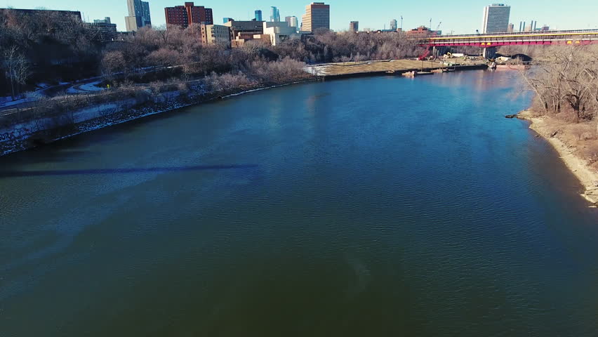 aerial view rising up from the Mississippi River to reveal the Minneapolis Minnesota skyline 1