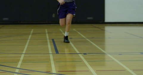 basketball female runs sprints on court slow motion close up 4k